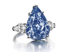 This handout picture released on April 25, 2014 by Christie’s auction house shows “The Blue” a fancy vivid blue pear-shaped diamond, weighing approximately 13.22 carats, flanked on either side by a pear-shaped diamond, weighing approximately 1.00 and 0.96 carat. 